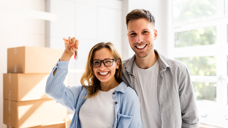 Happy couple moving into new home