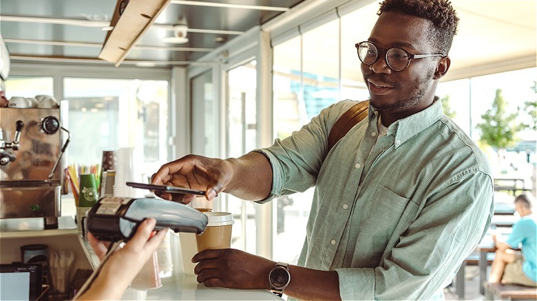 Person paying with his phone