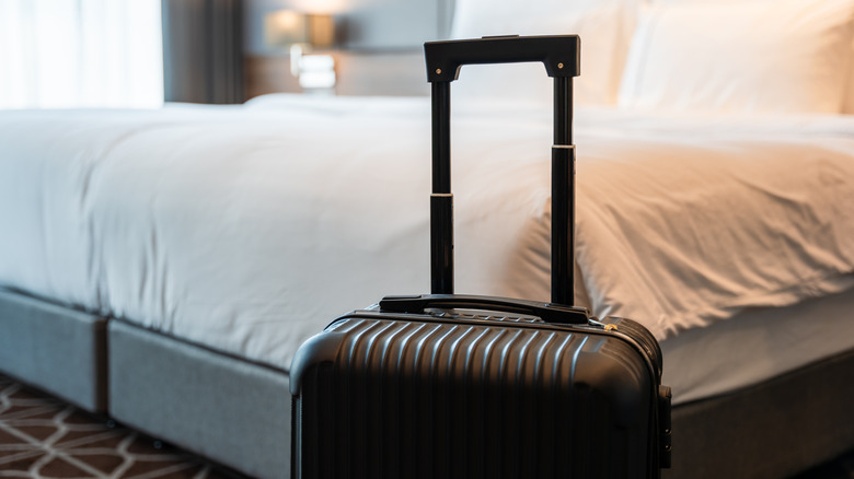 A suitcase in a luxury hotel room