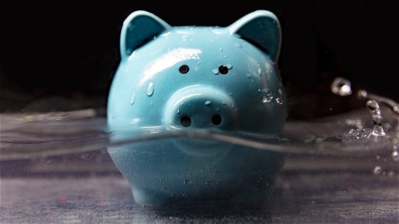 Piggy bank half in water