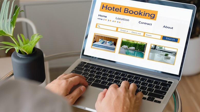 Person using a laptop computer to search travel sites