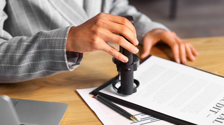 Notary public applying official seal