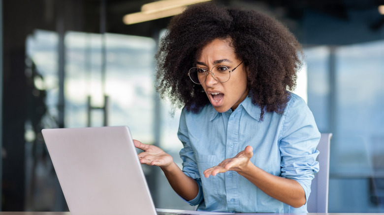 Frustrated woman finding out a product she owns has been recalled