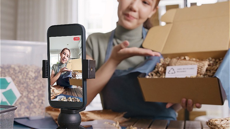 Person displaying product to viewers