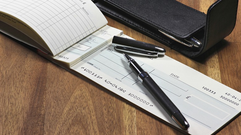 Image of check with pen