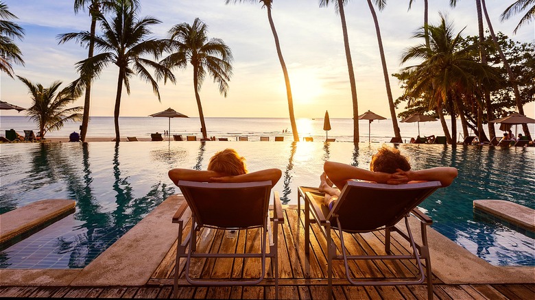 Couple lounging by resort pool