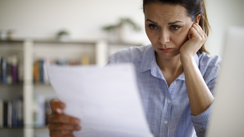 Woman looking at paperwork