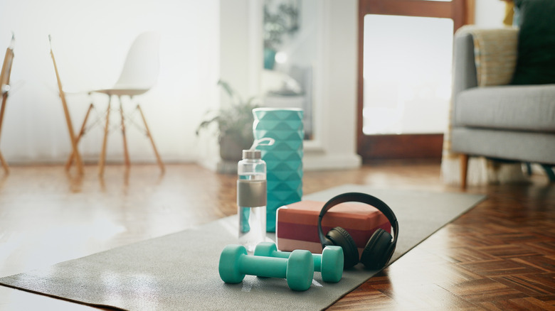 weights and an exercise mat at home