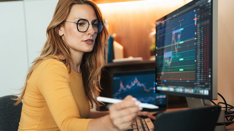 woman looking at stock market charts