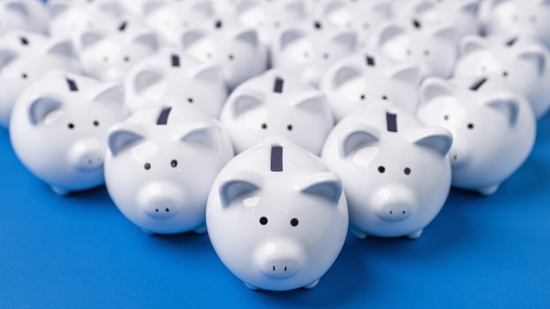 a triangular formation of piggy banks