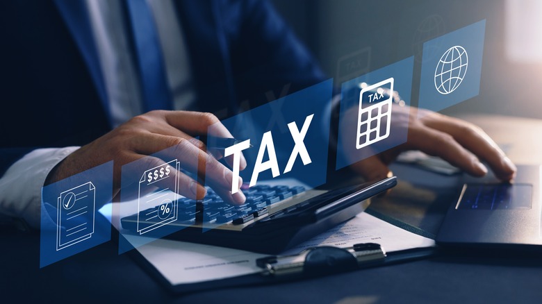 man calculating income taxes