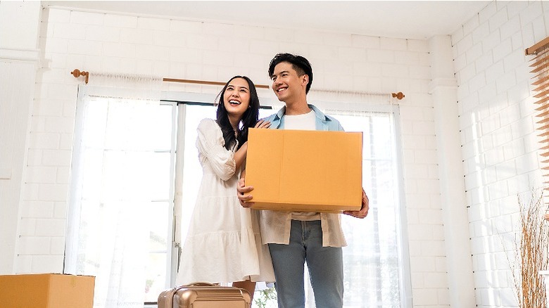 Happy couple move into home
