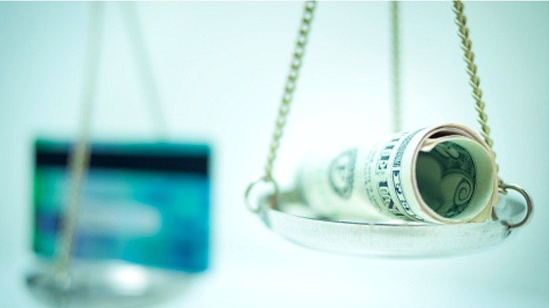 Credit card versus money scale