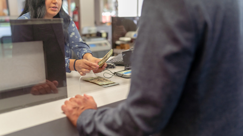 Person getting cash at their bank