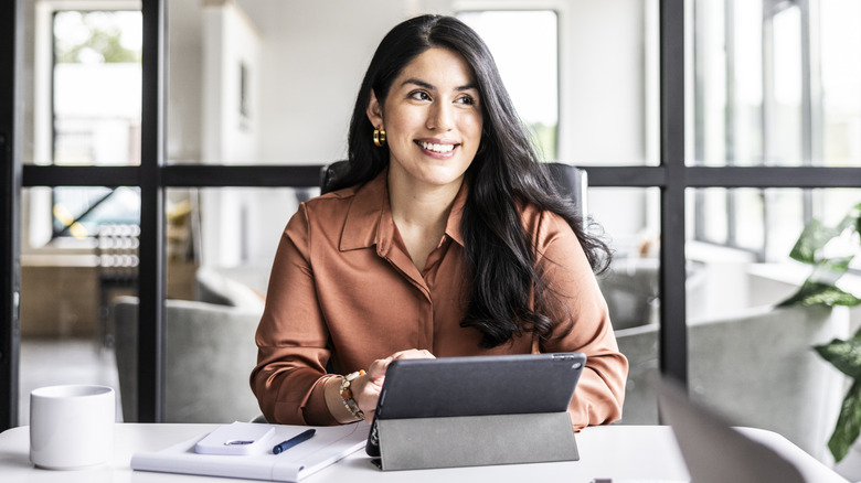 Young professional woman working at a desk