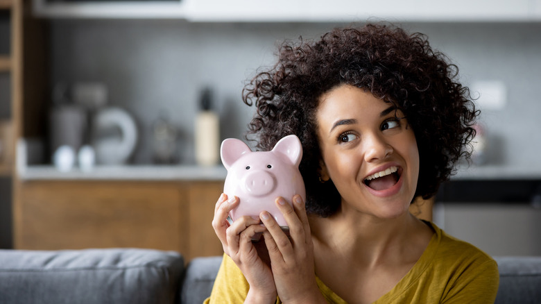 Woman with piggy bank
