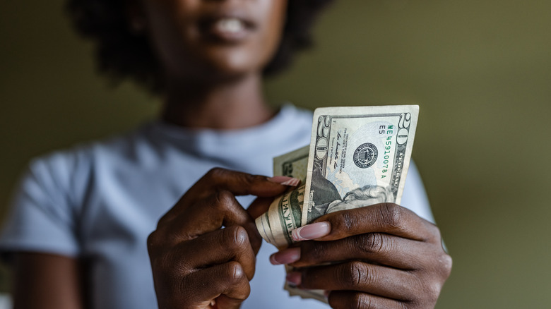 Woman holding cash