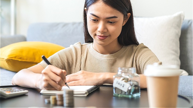 Young person calculating finances