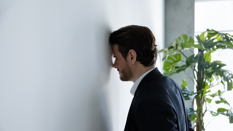 man thinking about a failure