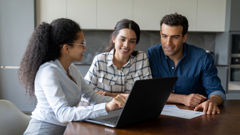 Loan officer discussing rates with a couple
