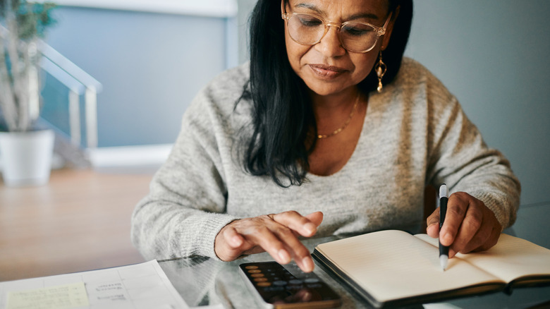 Mature woman working on paperwork