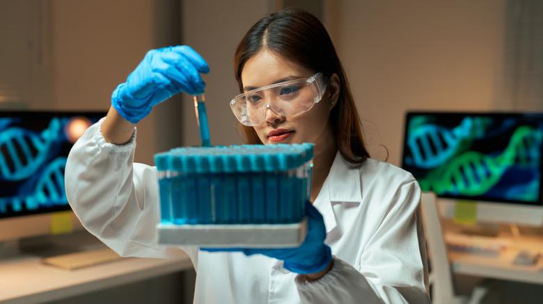 Researcher in a lab working with testing equipment