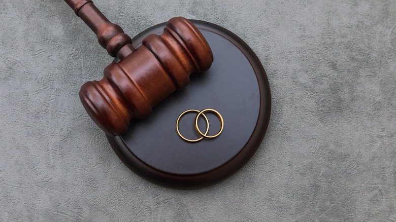 Gavel with wedding rings