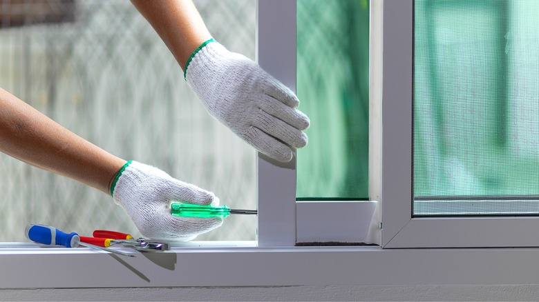 Person repairing sliding door
