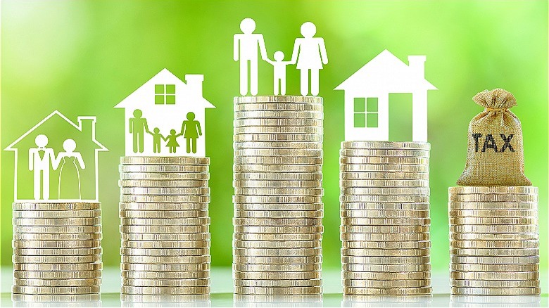 Cutouts of families atop money