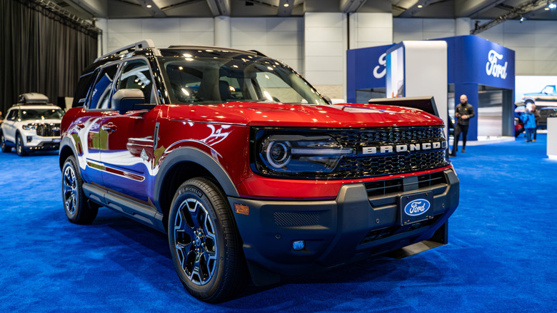 A red Ford Bronco Sport on a blue carpet at the 2025 Canadian car show