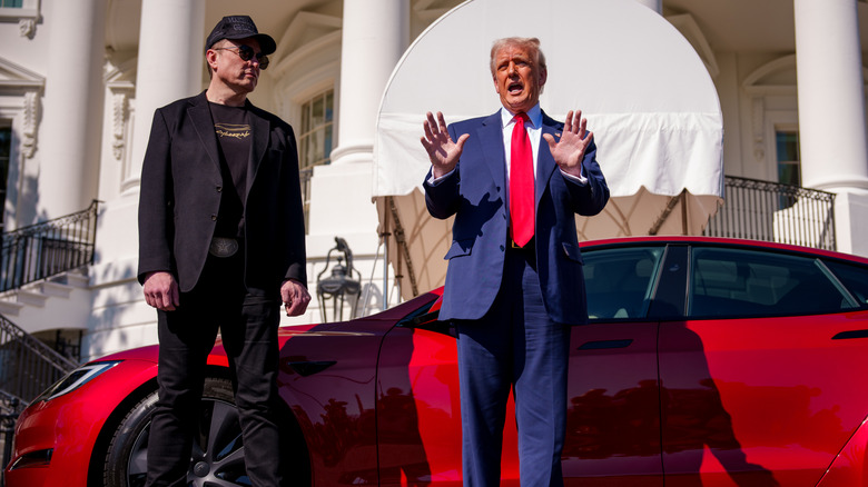 Elon Musk and President Trump show off a Tesla outside of the White House.