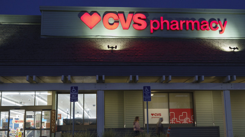 The exterior of a CVS pharmacy store seen in the night light