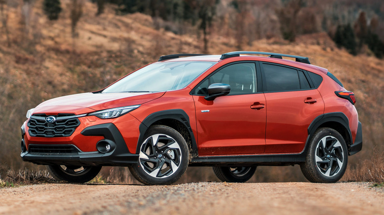 Orange Subaru Crosstrek parked off road