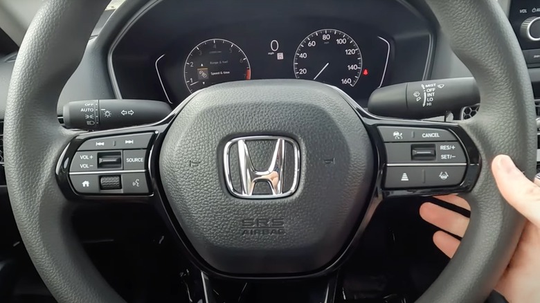 Steering wheel and cluster of a 2025 Honda Civic LX