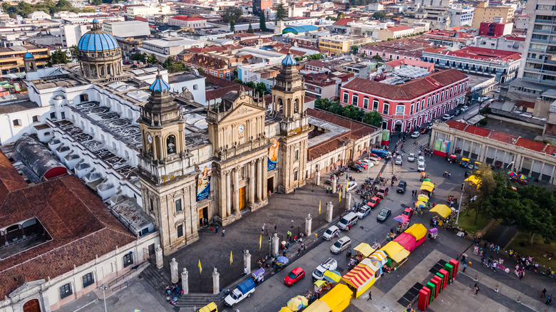 traffic around a cathedral in Guatemala City