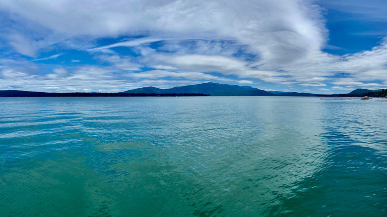 Lake Almanor with clouds above and mountains in the distance
