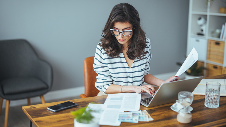 Woman on computer doing taxes and other paperwork