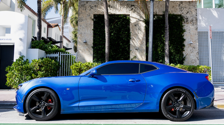 Metallic blue Chevrolet Camaro parked on street