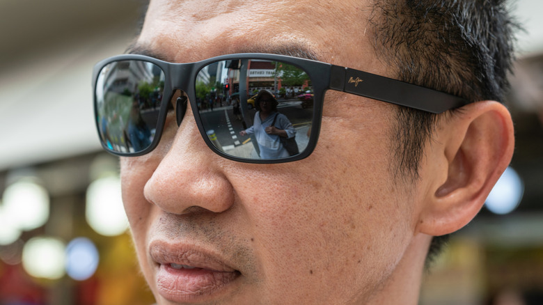closeup of man wearing Maui Jim sunglasses