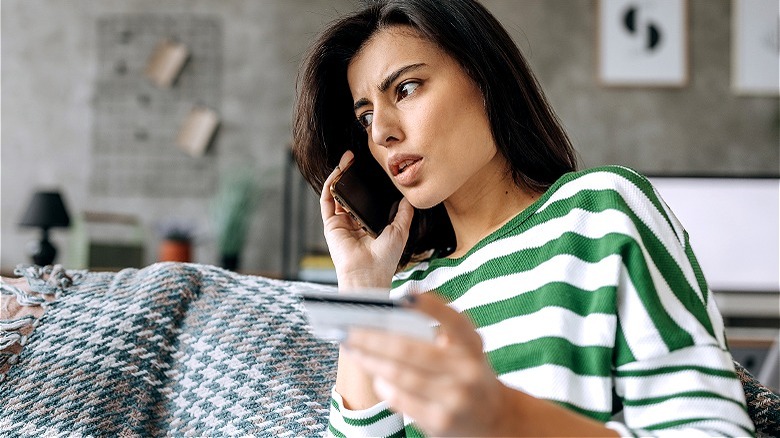 Worried person calling card issuer