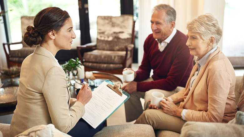Senior couple meeting with financial advisor.