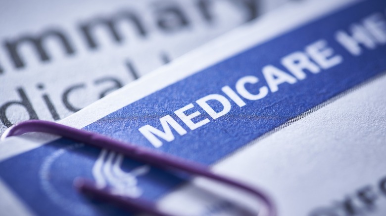 Close-up of a Medicare document with purple paperclip attached