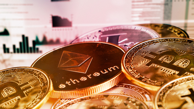 Crypto coins in front of pricing charts and information