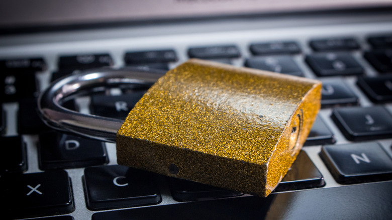 The close up image of lock (Padlock) on laptop computer.