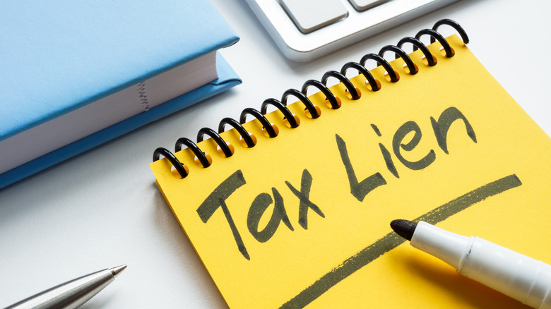 tax lien written on note pad