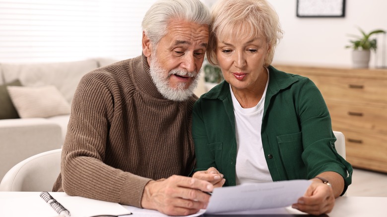 Older couple looking at a document together