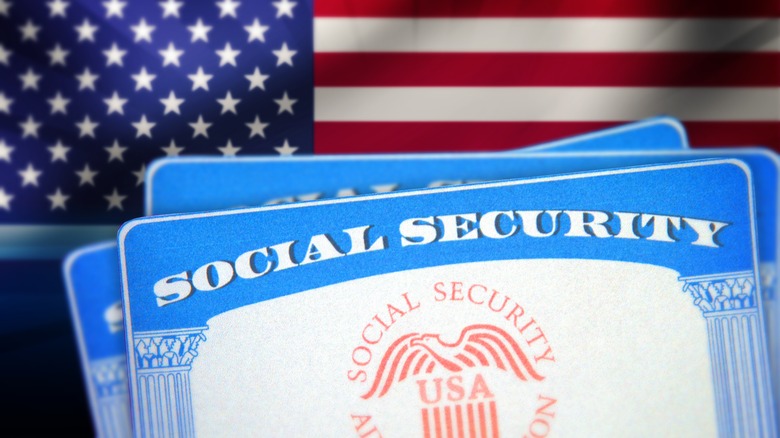 Social Security Card with blur American flag waving in the backdrop