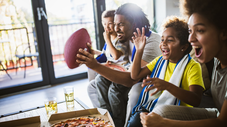 Family watching football game