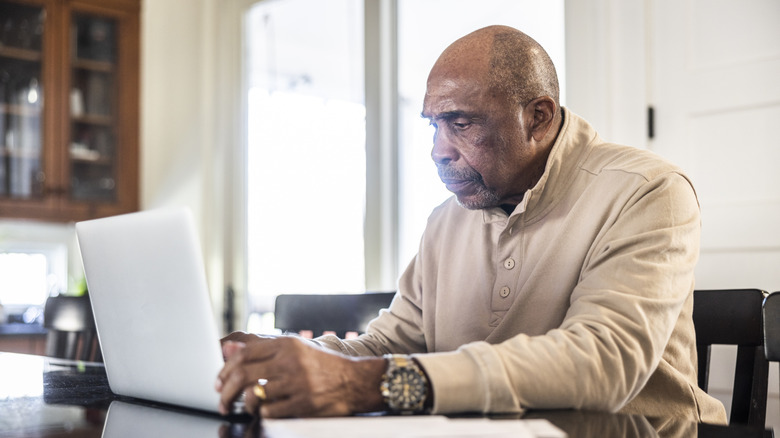 Senior man on laptop