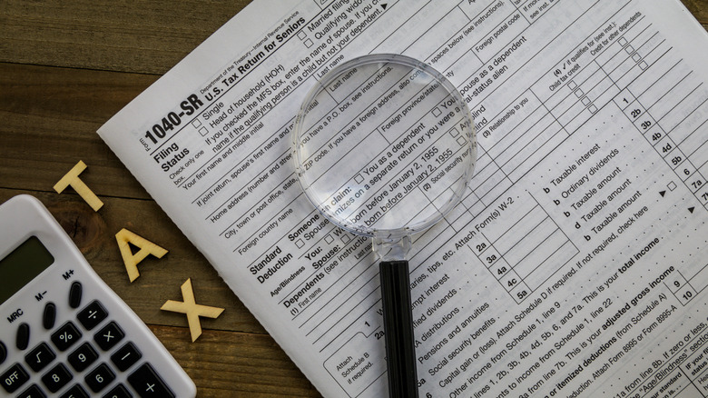 1040_SR and a magnifying glass